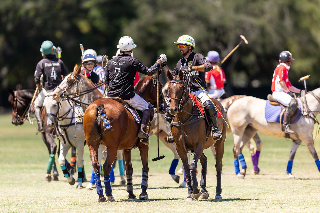 Polo players mid-game on a California field